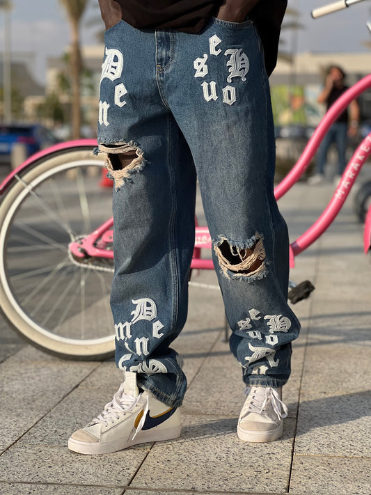 Rips baggy fit jeans with stitch leather letters