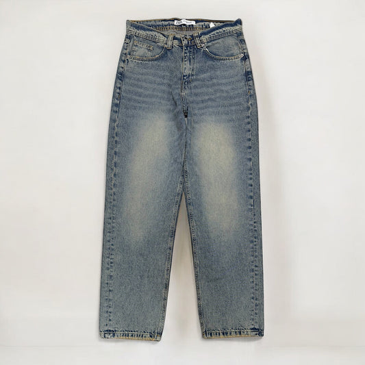 Baggy fit jeans with yellow tint in mid blue washed