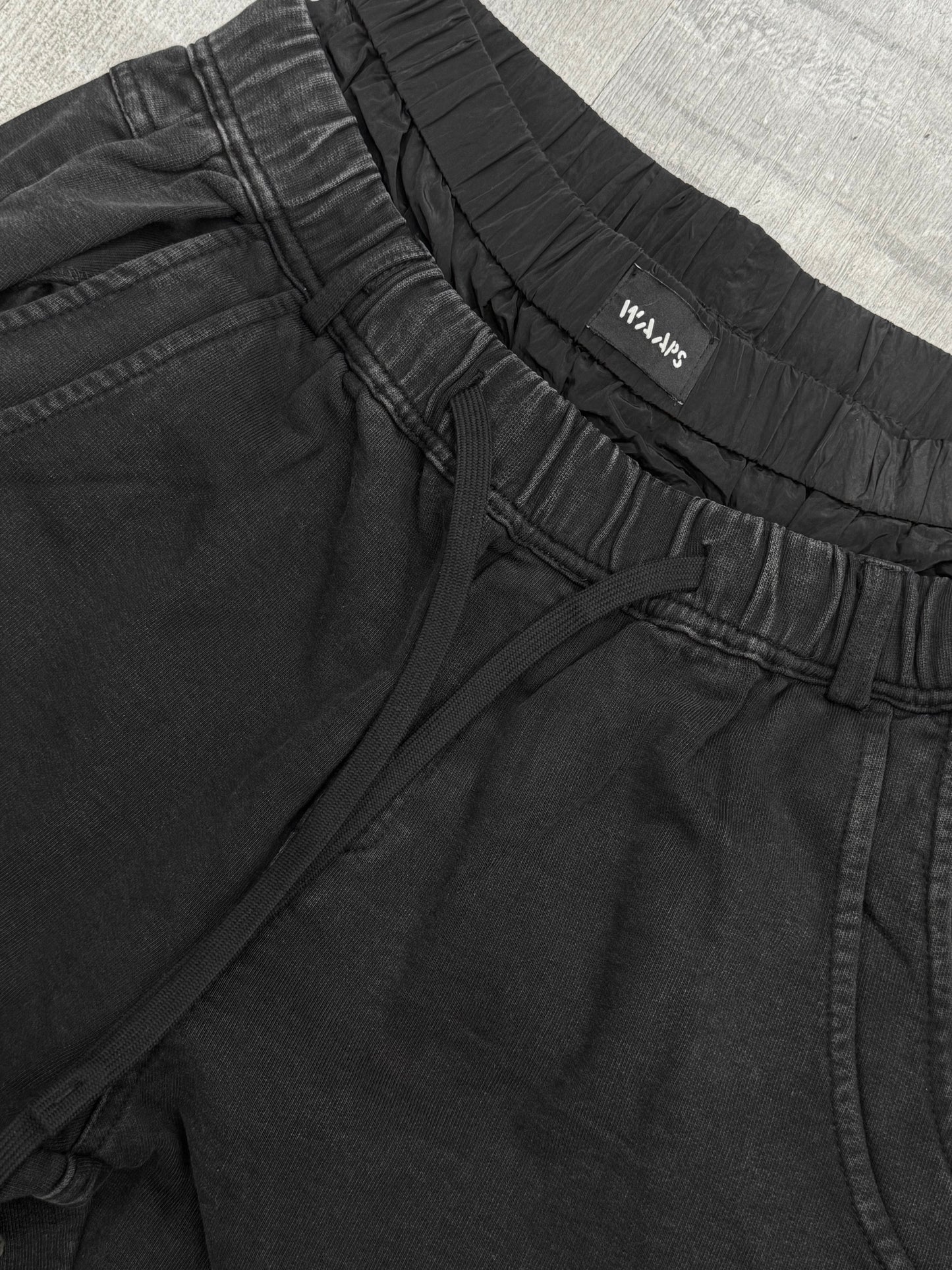 Wide leg sweatpants with waterproof layer in black washed