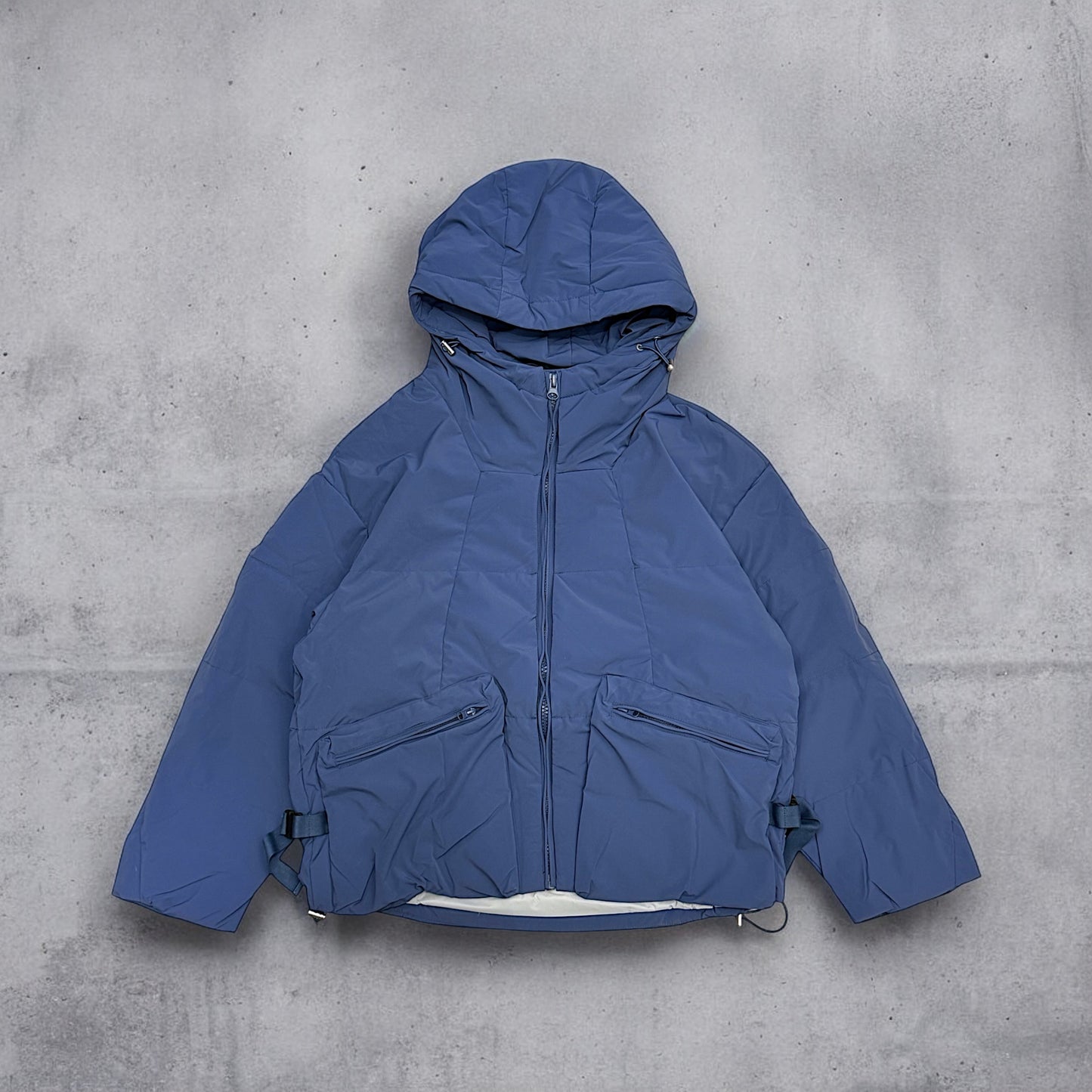 Hooded puffer jacket with side belt